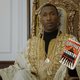 Mahershala Ali as Don Shirley, with the cover of Lovecraft Country.